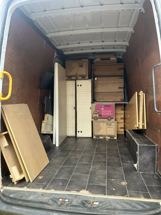 Wardrobes, boards and boxes, loaded and secured.
