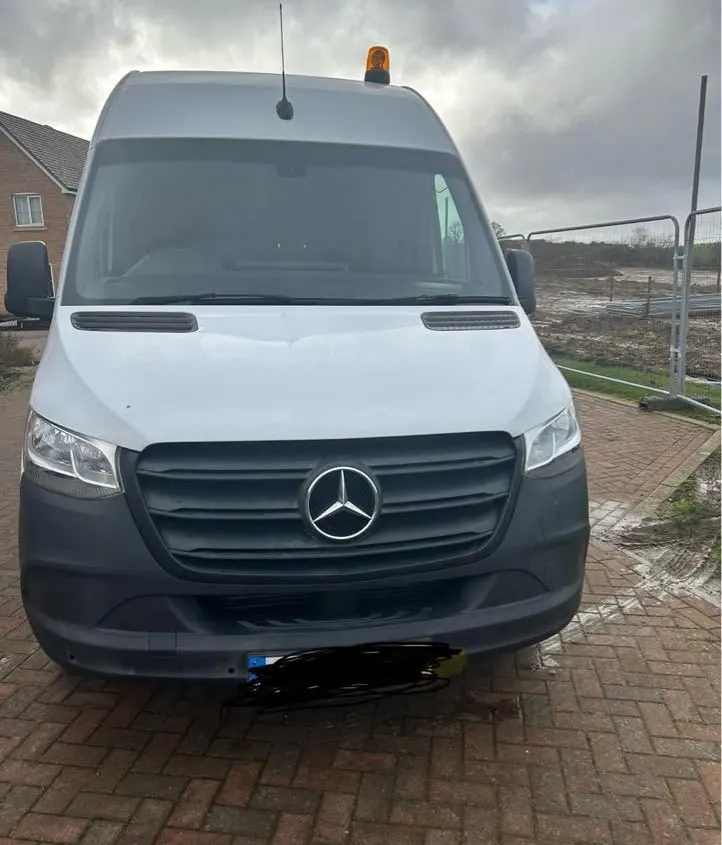 Our white Mercedes-Benz Sprinter van with its amber roof beacon